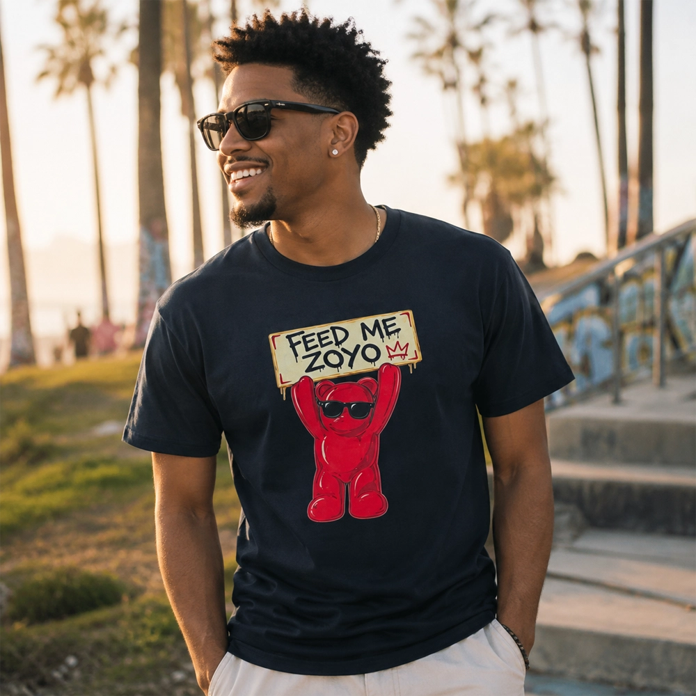 Man wearing the black Feed Me ZOYO Buddy Tee outdoors